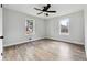 Bright bedroom featuring a modern ceiling fan and hardwood floors at 1751 Nathan Ln, Austell, GA 30168