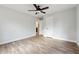 Bedroom featuring a ceiling fan, hardwood floors, and closet at 1751 Nathan Ln, Austell, GA 30168