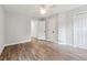 Bedroom showcasing wood floors, white trim, and a large closet at 1751 Nathan Ln, Austell, GA 30168