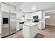 Kitchen featuring white cabinets, stainless steel appliances, and center island at 1751 Nathan Ln, Austell, GA 30168