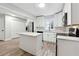 Kitchen featuring white cabinets, stainless steel appliances, and center island at 1751 Nathan Ln, Austell, GA 30168