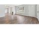 Inviting living room featuring a front door, large window, and hardwood floors at 1751 Nathan Ln, Austell, GA 30168