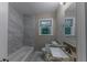 Updated bathroom with granite countertop and marble tile at 3147 Canary Ct, Decatur, GA 30032