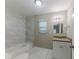Updated bathroom with granite countertop and marble tile at 3147 Canary Ct, Decatur, GA 30032