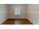 Bright bedroom with hardwood floors and wainscoting at 3147 Canary Ct, Decatur, GA 30032