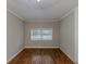 Charming bedroom with hardwood floors and a large window at 3147 Canary Ct, Decatur, GA 30032