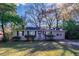 Ranch style home with a well-maintained lawn and mature trees at 3147 Canary Ct, Decatur, GA 30032