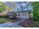Charming ranch home featuring a spacious yard and driveway at 3147 Canary Ct, Decatur, GA 30032