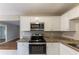 Renovated kitchen with stainless steel appliances and granite at 3147 Canary Ct, Decatur, GA 30032