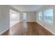 Hardwood floors and an open floor plan highlight this spacious living room at 3147 Canary Ct, Decatur, GA 30032