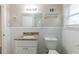 Updated bathroom with granite vanity and toilet at 1360 Lockhaven Sw Cir, Atlanta, GA 30311