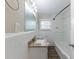 Clean bathroom with granite countertop and bathtub at 1360 Lockhaven Sw Cir, Atlanta, GA 30311