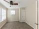 Cozy bedroom with ceiling fan and window at 1360 Lockhaven Sw Cir, Atlanta, GA 30311