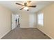 Well-lit bedroom with ceiling fan and access to hallway at 1360 Lockhaven Sw Cir, Atlanta, GA 30311