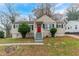 Charming ranch home with red door and landscaped yard at 1360 Lockhaven Sw Cir, Atlanta, GA 30311