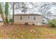 Tan house exterior with windows and AC unit at 1360 Lockhaven Sw Cir, Atlanta, GA 30311