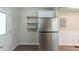 Kitchen with stainless steel refrigerator and wood shelving at 1360 Lockhaven Sw Cir, Atlanta, GA 30311