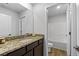 Well-lit bathroom with a granite countertop vanity and a view of the shower and toilet area at 819 Major Oak Ct, Villa Rica, GA 30180