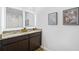 Bathroom featuring double vanity with granite countertop and framed, lighted mirrors at 819 Major Oak Ct, Villa Rica, GA 30180