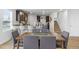 Elegant dining room with modern furniture and a view into the open-concept kitchen at 819 Major Oak Ct, Villa Rica, GA 30180