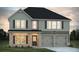 Charming two-story home featuring a brick and siding exterior with an attached two-car garage at 819 Major Oak Ct, Villa Rica, GA 30180