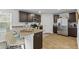 Modern kitchen with granite countertops, stainless steel appliances, and a breakfast bar with seating at 819 Major Oak Ct, Villa Rica, GA 30180