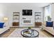 Cozy living room with a modern fireplace, stylish decor, and comfortable seating at 819 Major Oak Ct, Villa Rica, GA 30180