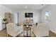 Living room featuring neutral walls, wood flooring, and stylish decor at 819 Major Oak Ct, Villa Rica, GA 30180