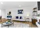 Bright living room with neutral walls, wood flooring, and stylish decor at 819 Major Oak Ct, Villa Rica, GA 30180