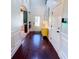 Bright entryway with hardwood floors and a yellow console table at 2239 Noelle Pl, Powder Springs, GA 30127