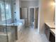 Bathroom with glass shower, soaking tub, and a double vanity at 3345 Hillshire Dr, Cumming, GA 30028