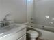 Clean bathroom with white tile and a bathtub at 3345 Hillshire Dr, Cumming, GA 30028