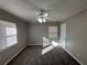 Well-lit bedroom with ceiling fan and neutral decor at 721 Yale Sw Pl, Atlanta, GA 30315