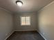 Cozy bedroom with neutral walls and carpet flooring at 721 Yale Sw Pl, Atlanta, GA 30315