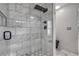 Large walk-in shower with marble tile and rainfall shower head at 1136 Goodwin Ne Rd, Atlanta, GA 30324