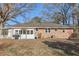 Brick house exterior with a sunroom and covered patio at 2051 Sheffield Rd, Conyers, GA 30012