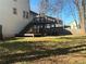 Spacious backyard with a large deck and privacy fence at 627 Huntington Nw Way, Lilburn, GA 30047
