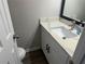 Updated bathroom with white vanity and quartz countertop at 627 Huntington Nw Way, Lilburn, GA 30047