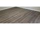 Large bedroom with hardwood floors and neutral walls at 627 Huntington Nw Way, Lilburn, GA 30047
