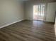 Spacious bonus room with sliding glass doors leading to the backyard at 627 Huntington Nw Way, Lilburn, GA 30047