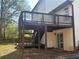 Elevated deck with stairs and access to backyard at 627 Huntington Nw Way, Lilburn, GA 30047