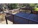 Spacious deck overlooking backyard with wooden fence at 627 Huntington Nw Way, Lilburn, GA 30047