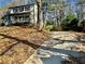 Two-story house with a gray exterior, front porch, and driveway at 627 Huntington Nw Way, Lilburn, GA 30047