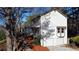 Two-story house with white siding, double garage, and landscaping at 627 Huntington Nw Way, Lilburn, GA 30047