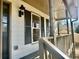 Front porch with dark-colored railing and shutters at 627 Huntington Nw Way, Lilburn, GA 30047
