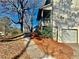 Side view of house showing garage and landscaping at 627 Huntington Nw Way, Lilburn, GA 30047