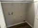 Convenient laundry area with hookups and built-in shelving at 627 Huntington Nw Way, Lilburn, GA 30047