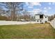 Fenced backyard with a spacious lawn at 2208 Baker Nw Rd, Atlanta, GA 30318