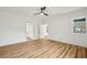 Spacious bedroom with hardwood floors, ample natural light, and an open doorway at 2208 Baker Nw Rd, Atlanta, GA 30318