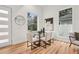 Dining area with glass table, modern chairs, and large windows at 2208 Baker Nw Rd, Atlanta, GA 30318